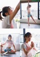 A woman in a white shirt and blue shorts doing yoga.